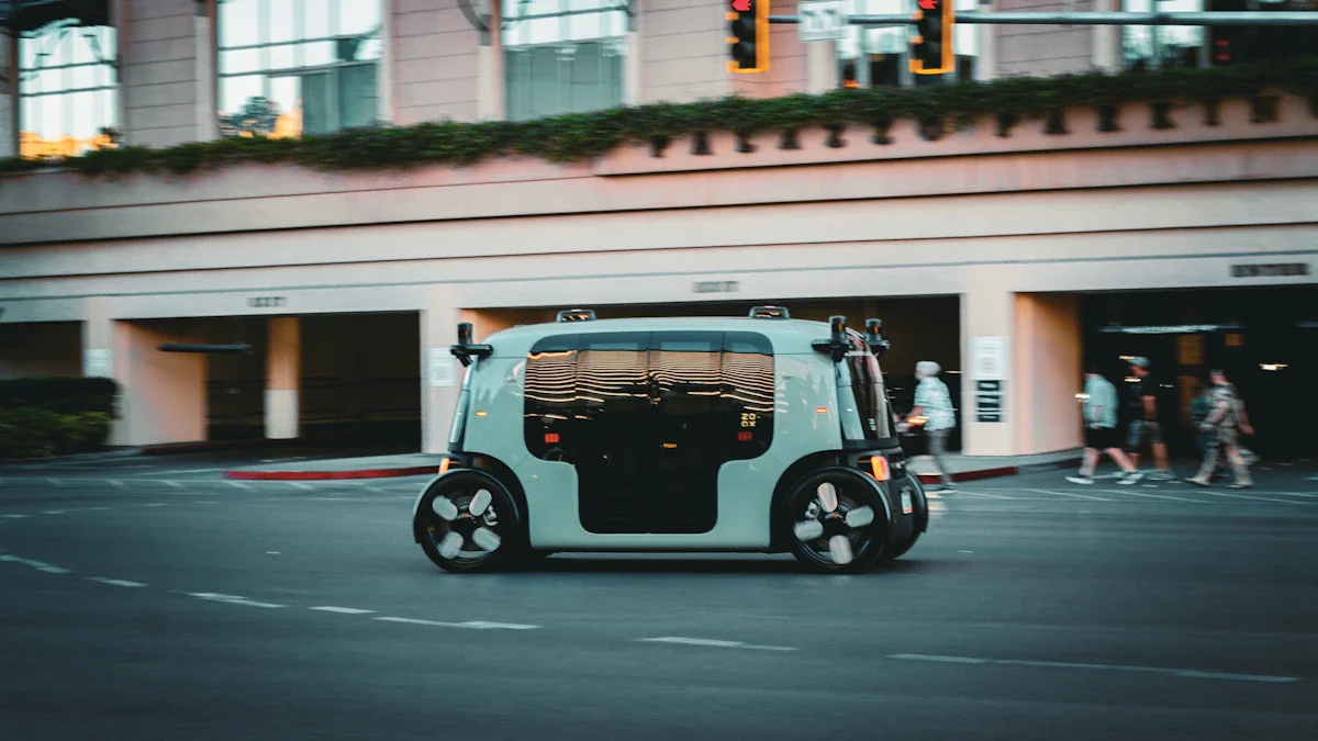 A sleek, mint-green autonomous shuttle driving along a city street during the evening.
