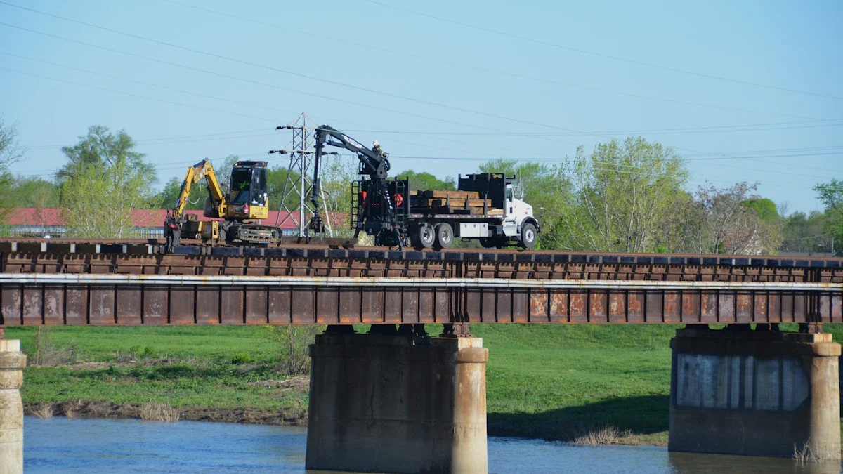 Construction machinery and a crane truck positioned on a bridge for essential repair work.