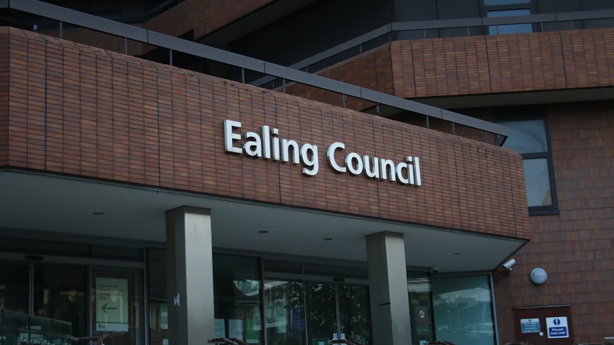 Close-up view of the Ealing Council building entrance sign in London.