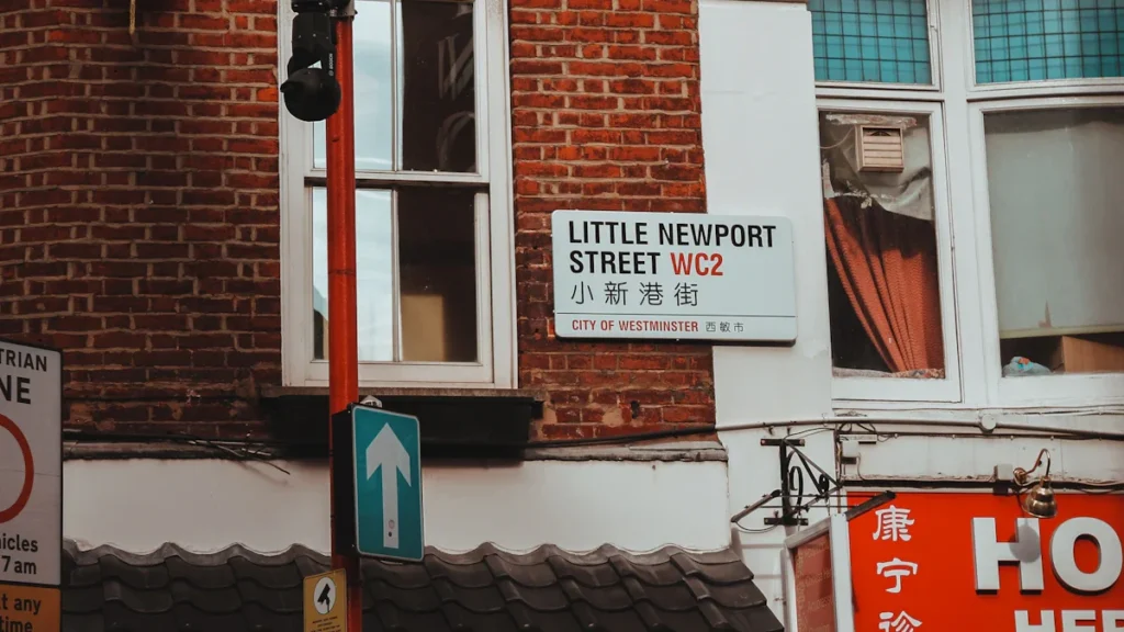 A classic street sign attached to a brick building in London.