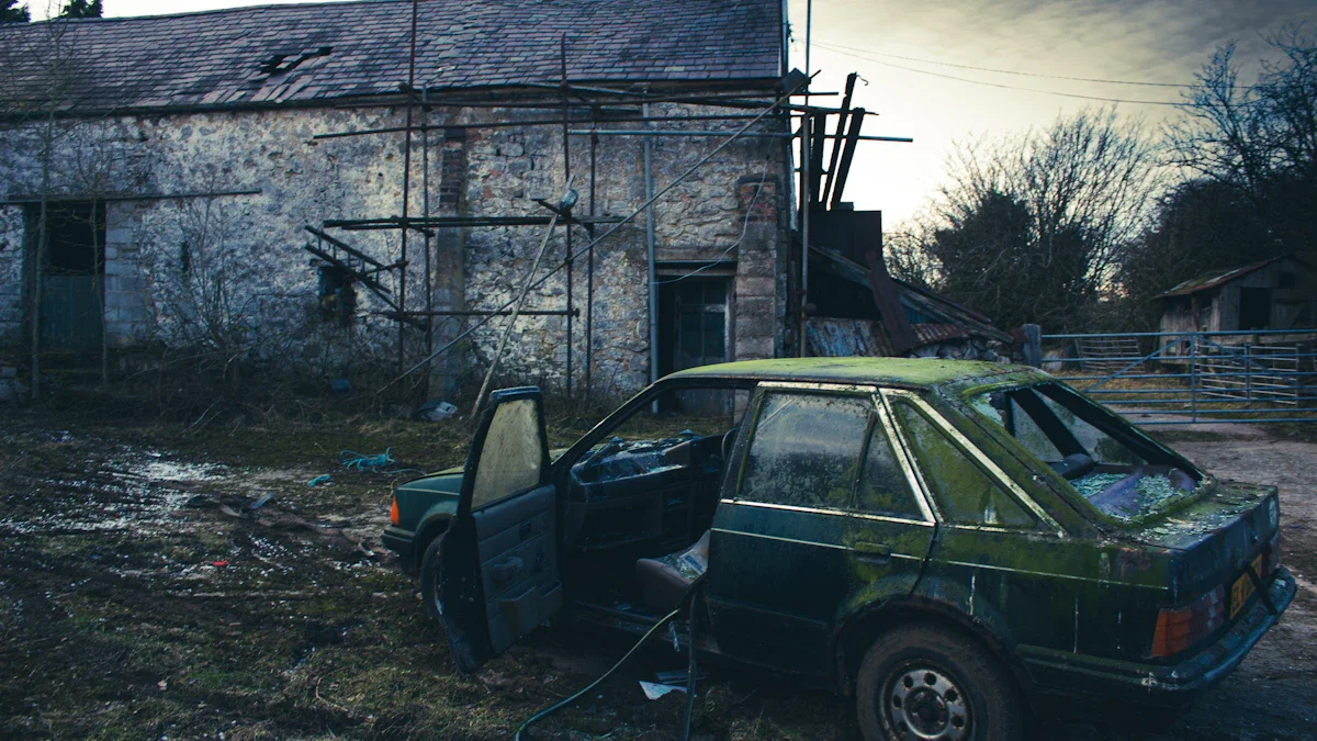 A moss-covered green car sits abandoned and derelict outside a stone building with scaffolding.