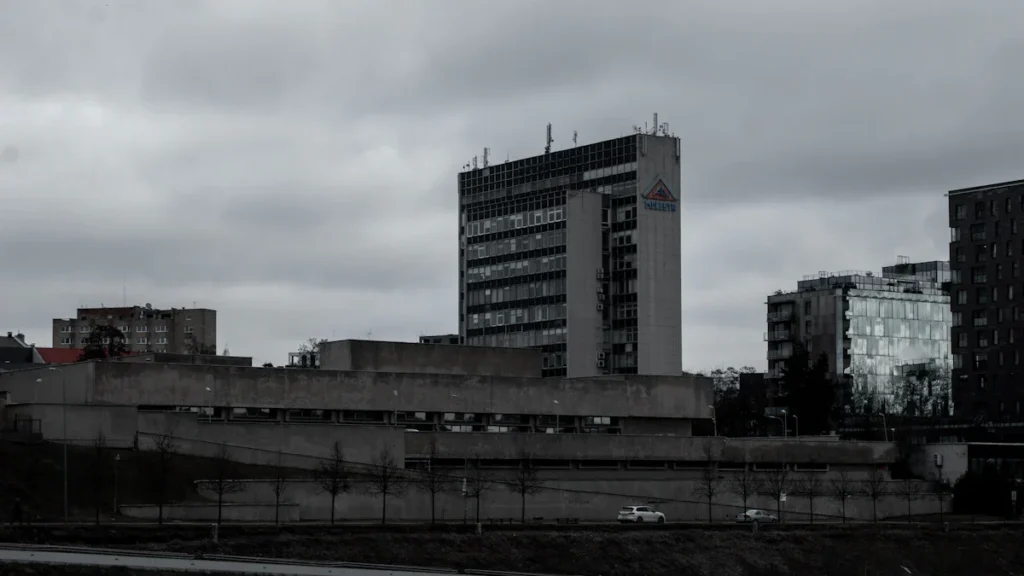 A view of the Vilnius skyline in Lithuania, featuring modern and brutalist administrative buildings.