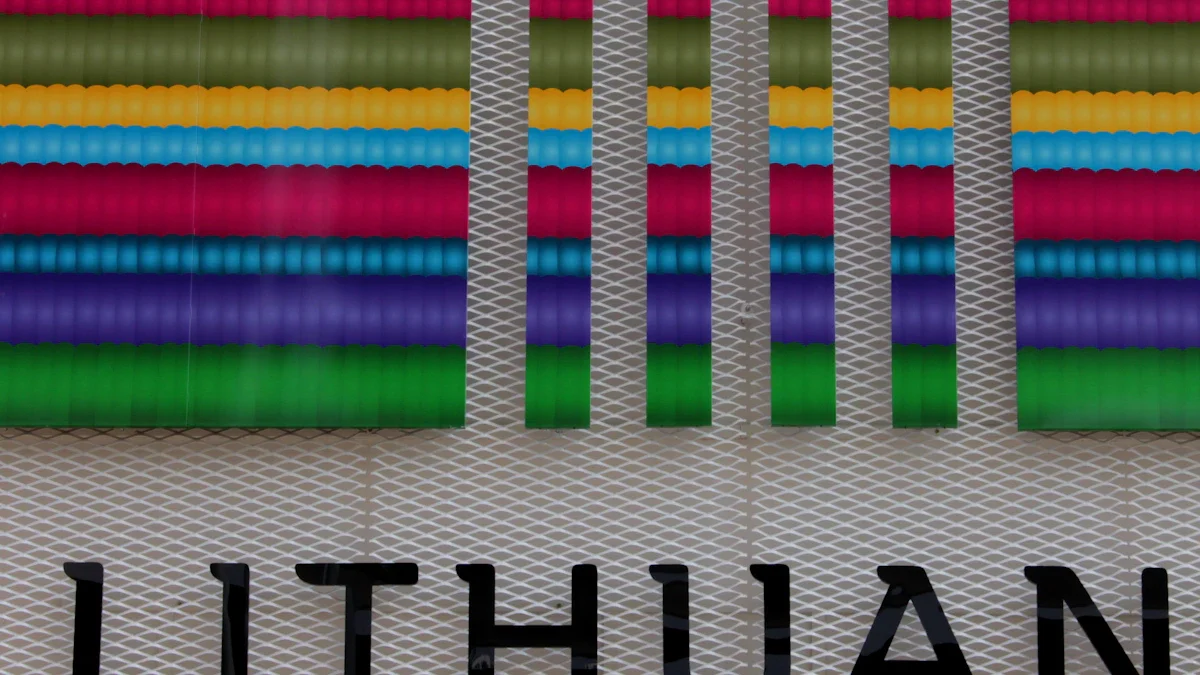 A modern building facade featuring colorful horizontal stripes and the word 'LITHUAN' in bold black letters.