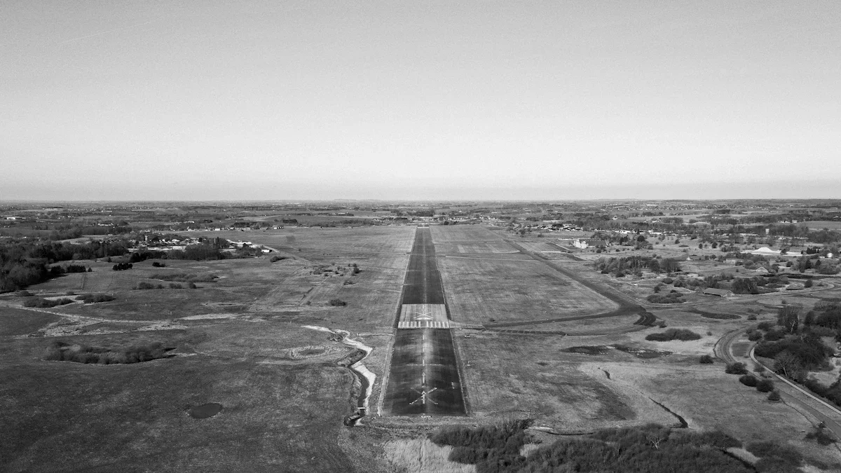 Aerial view of a long military runway in a rural landscape, representing infrastructure investment.