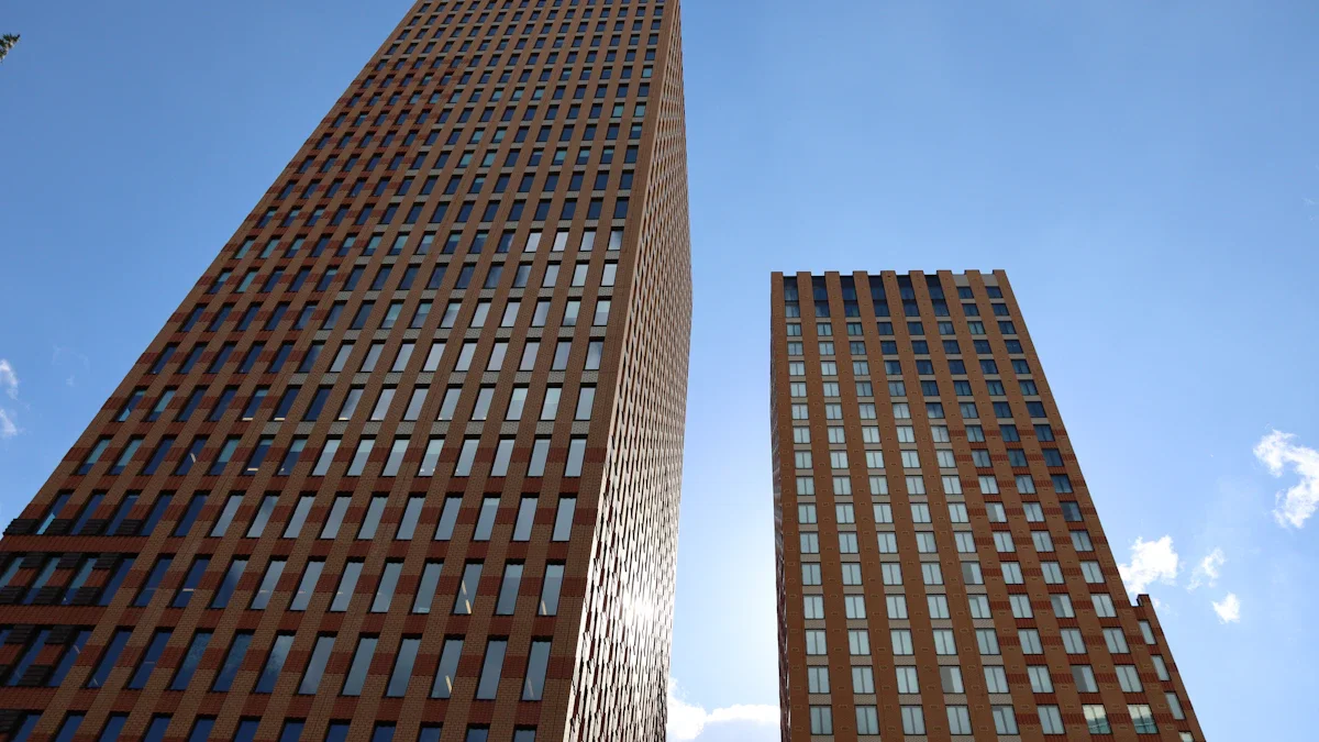 Two towering modern office buildings with uniform glass windows under a clear sky in a commercial hub.