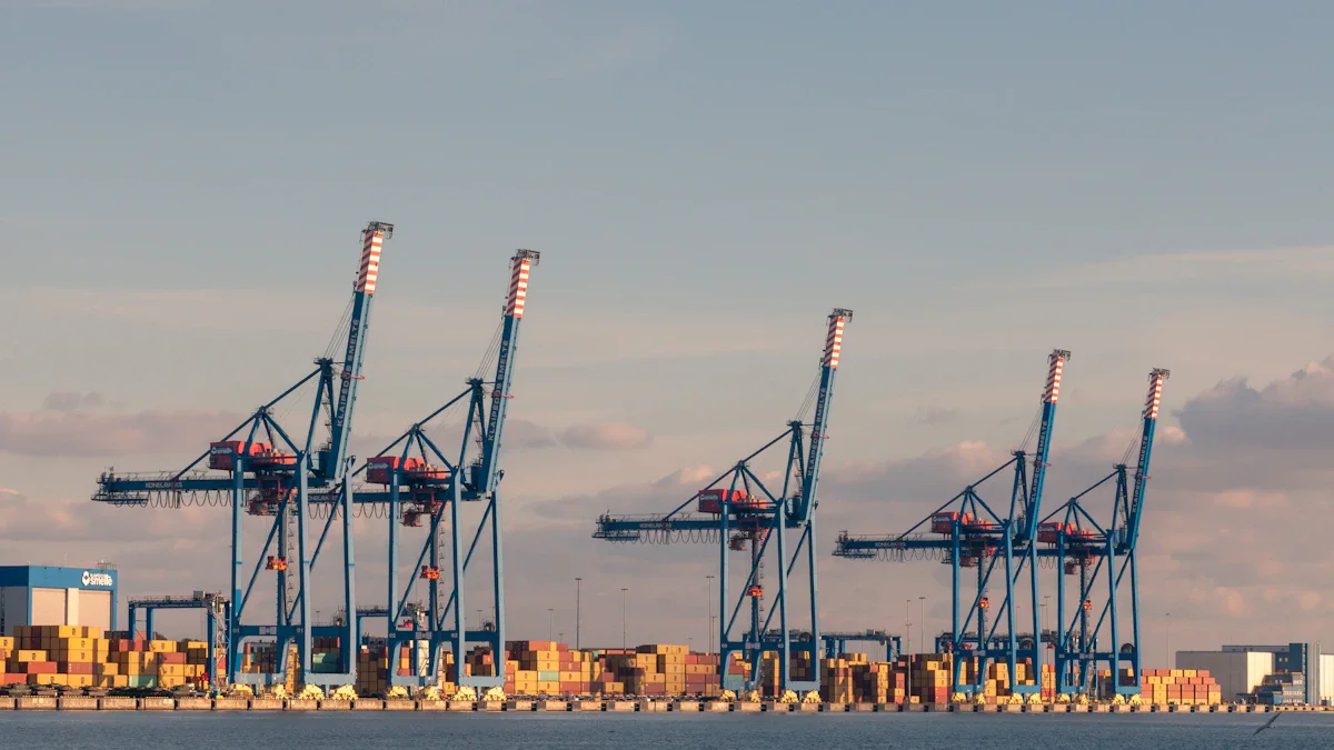 Large blue industrial shipping cranes stand over the Curonian Lagoon at the port of Klaipėda, Lithuania.