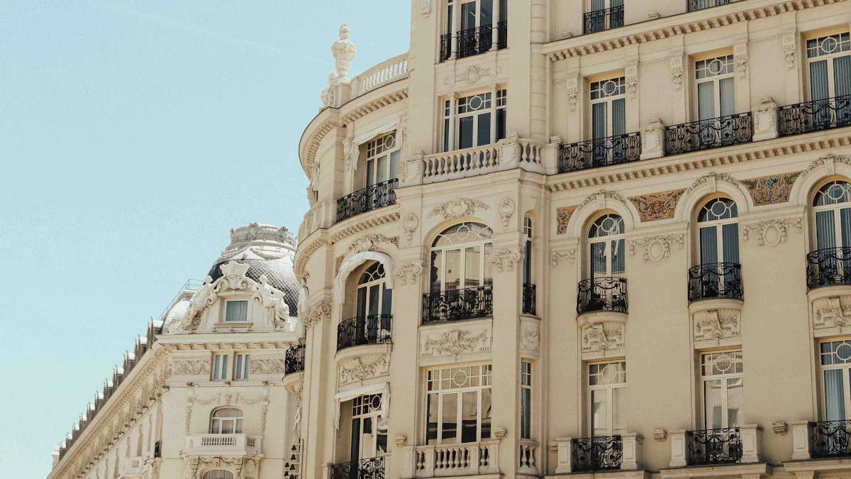 Close-up of a classical beige building facade with ornate architectural details and multiple window balconies.