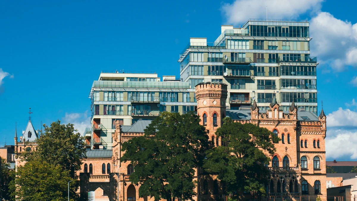 A modern glass apartment building rising behind a historic terracotta-colored building in Vilnius, Lithuania.