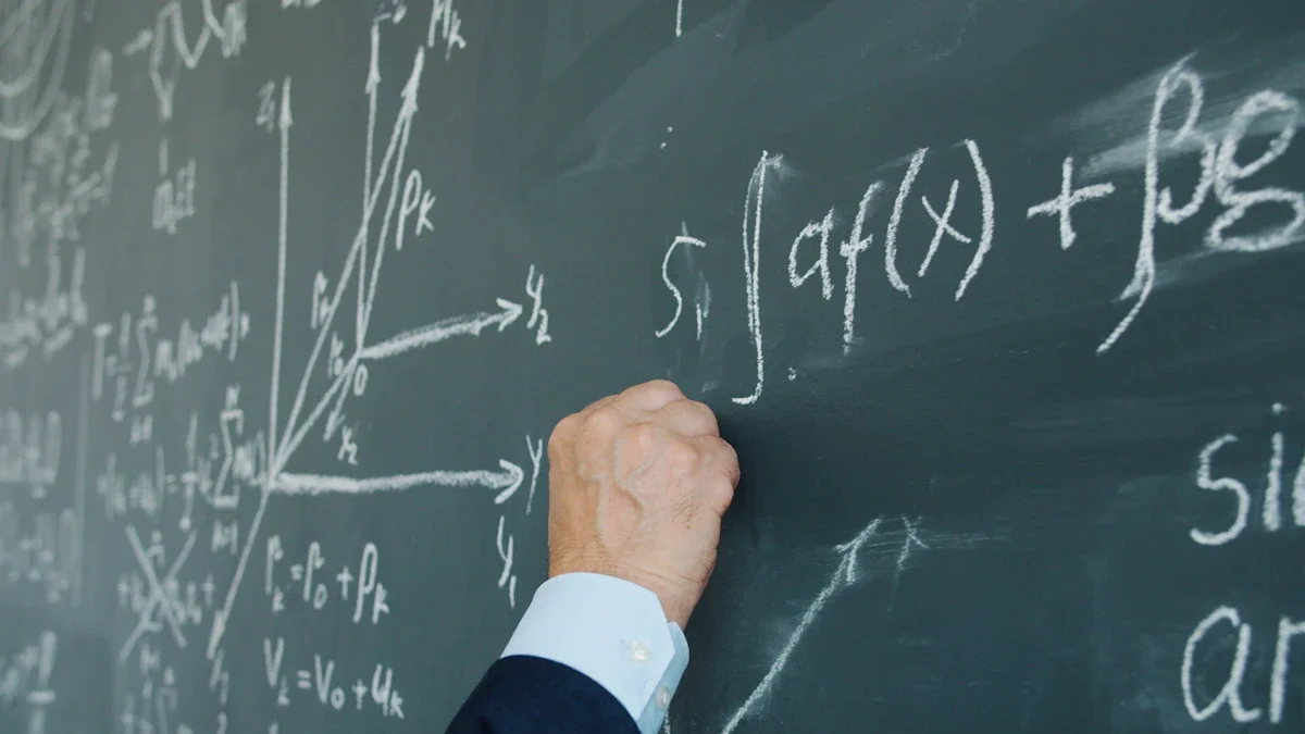 A close-up of a hand writing complex mathematical equations on a dark green chalkboard in a classroom.