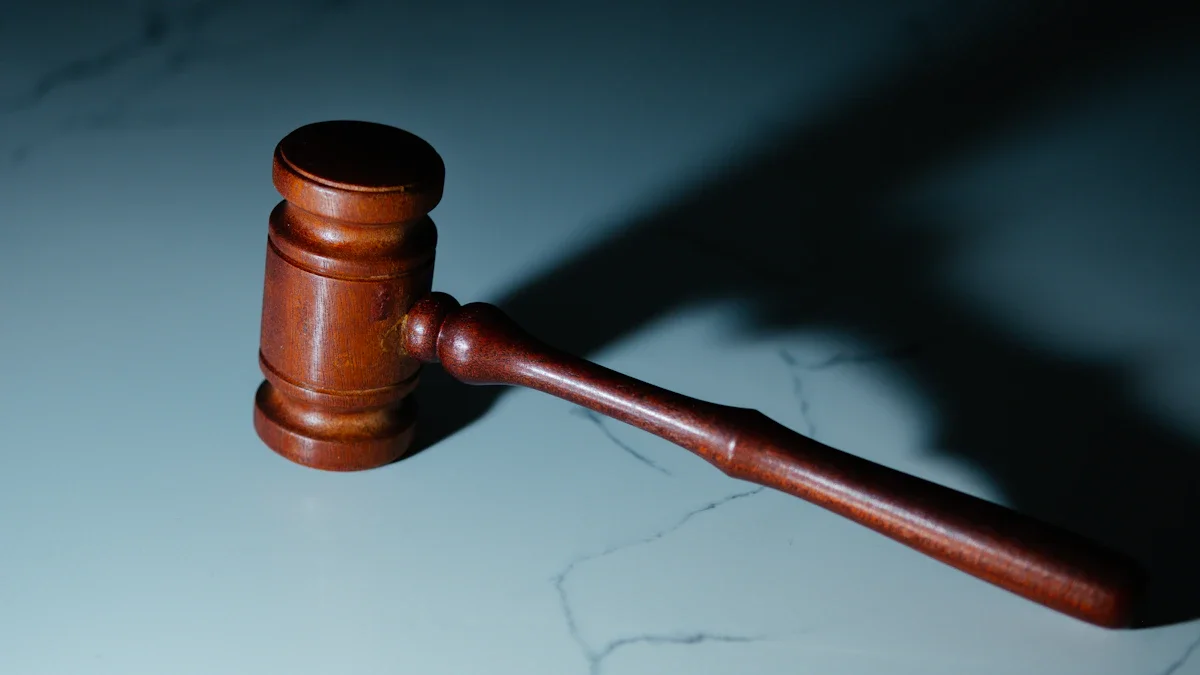 A wooden judge's gavel rests on a polished surface with dramatic spotlighting and deep shadows.
