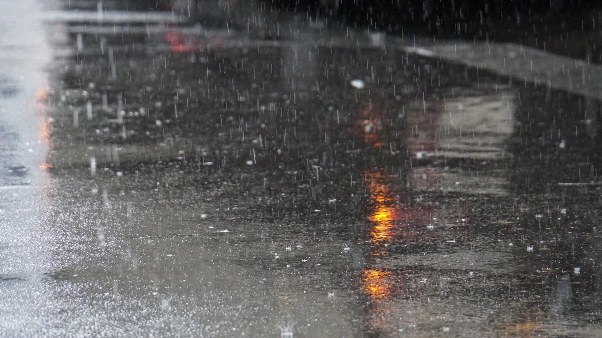 A red traffic light reflected in a rainy UK street at night.