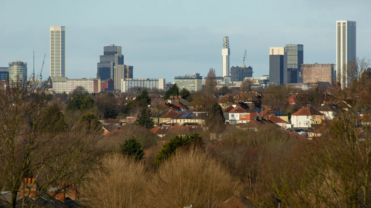 A wide-angle view of a British city skyline showing modern high-rise buildings and residential neighborhoods.