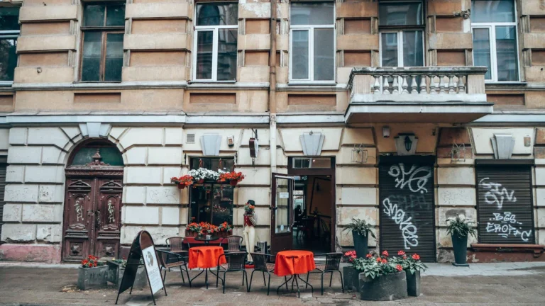 A sidewalk cafe in Lithuania with outdoor seating, representing a common setting for student summer jobs.
