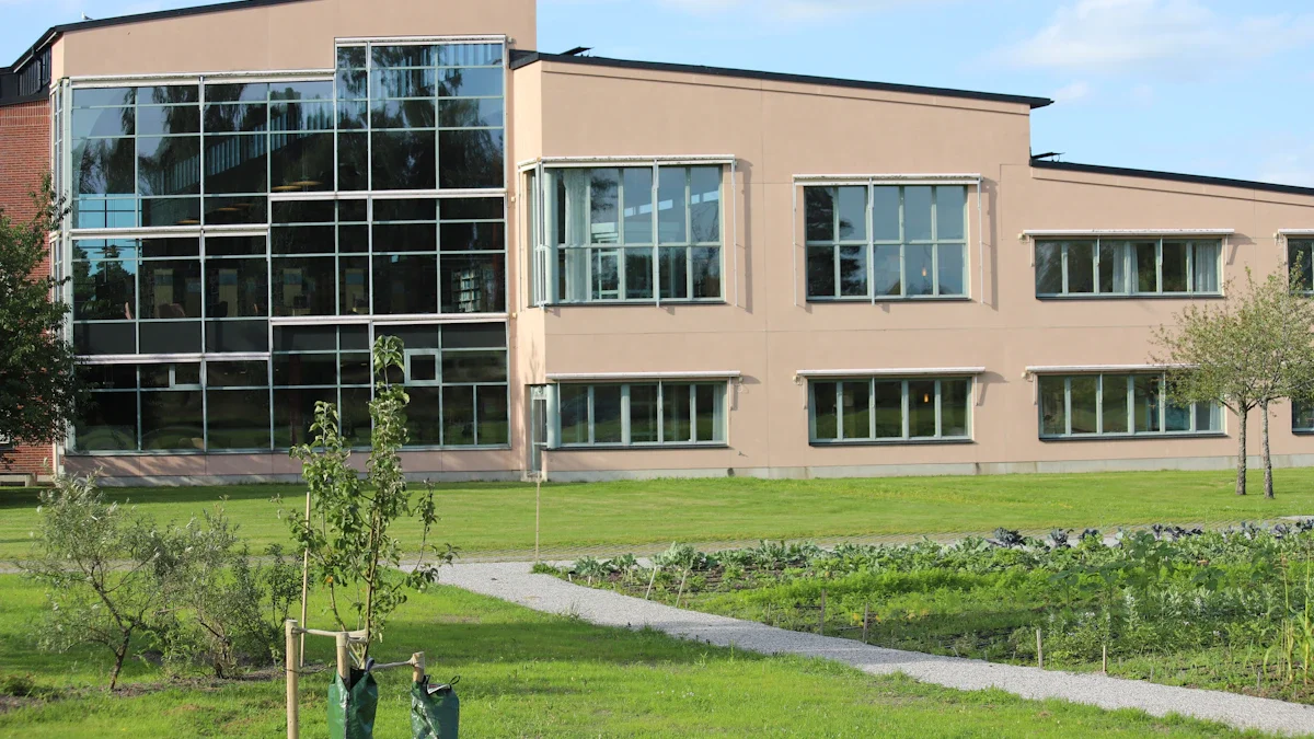 Modern educational building with large glass windows and contemporary architectural lines under a clear sky.
