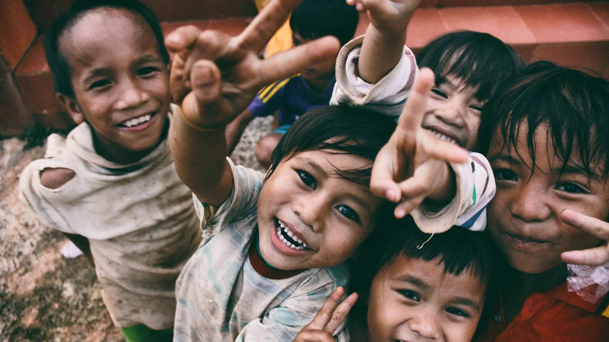 Group of young children smiling and giving peace signs to the camera