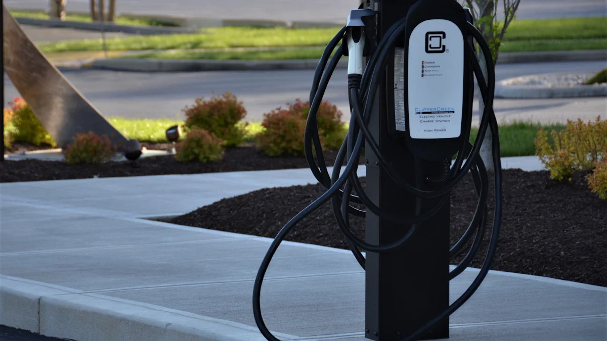 A black electric vehicle charging station standing on a suburban concrete sidewalk.