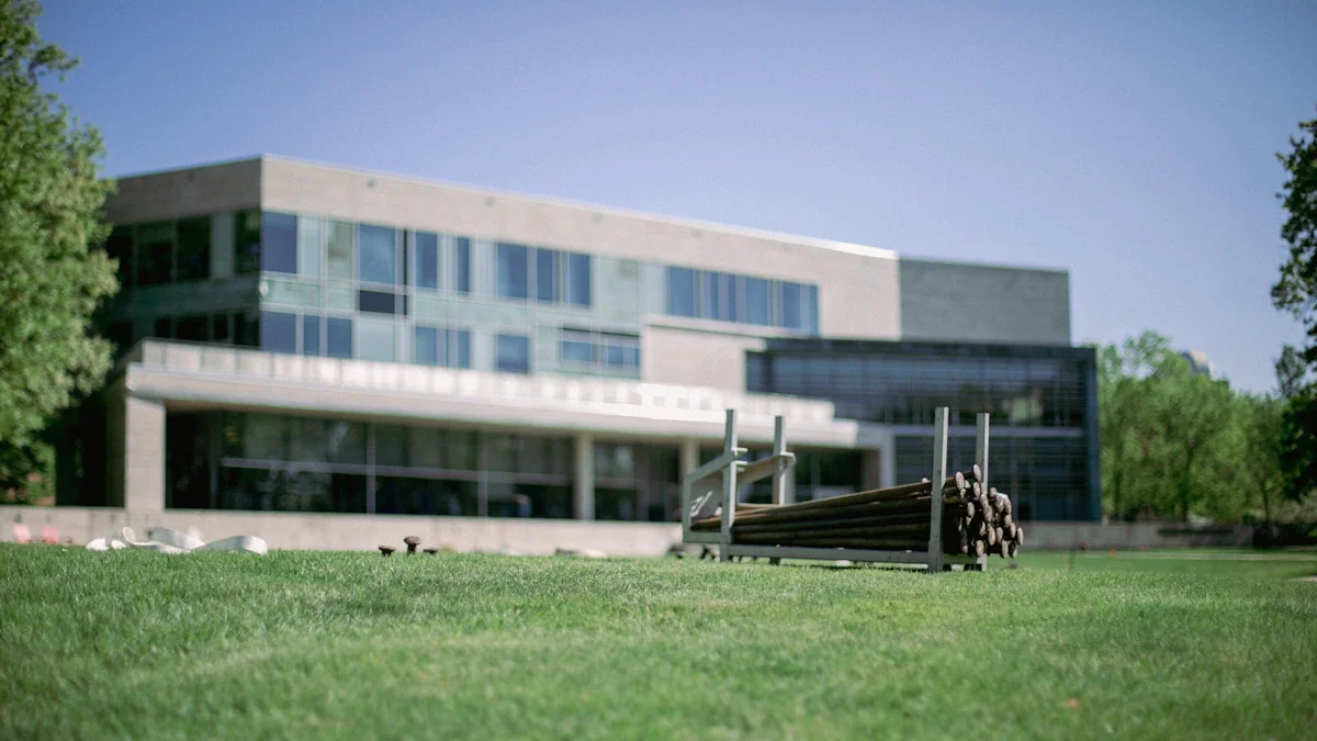 Modern building exterior with landscaped lawn foreground, representing potential for campus development projects.